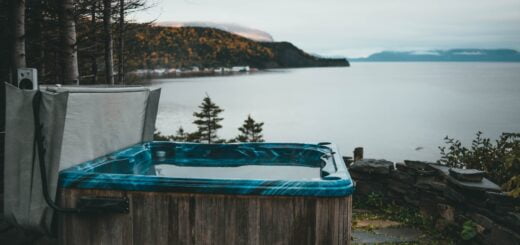a hot tub sitting next to a body of water